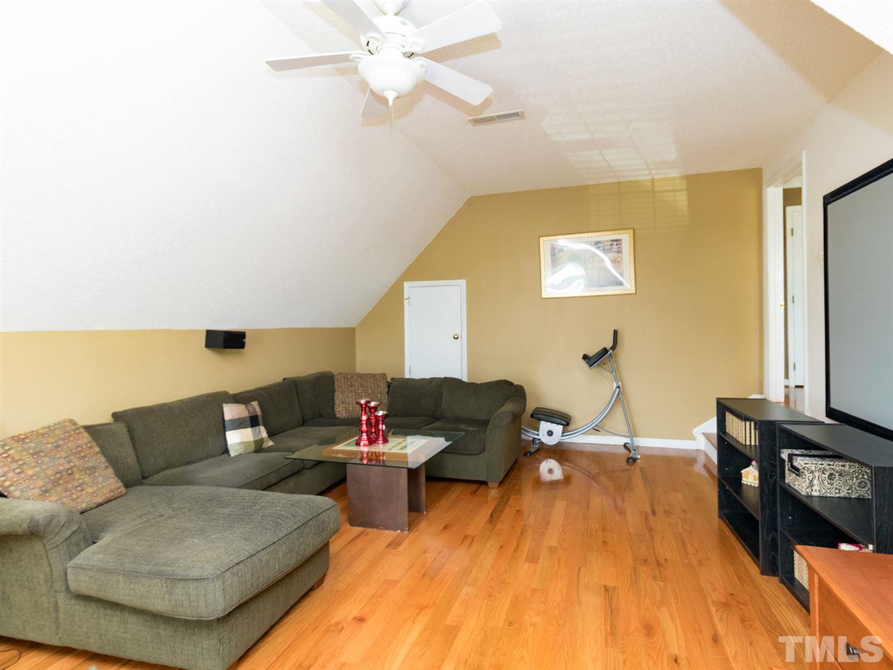2500 Bulmer Terrace Raleigh, NC 27615 - Photo 19 of 25 a living room with furniture and a flat screen tv