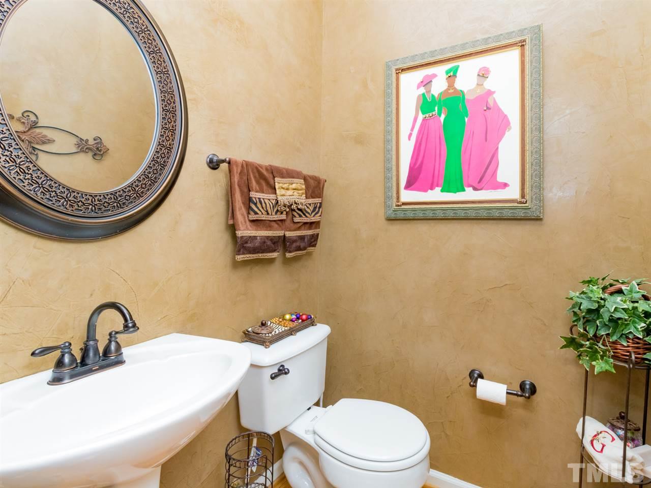 2500 Bulmer Terrace Raleigh, NC 27615 - Photo 20 of 25 a bathroom with a toilet a sink and a mirror