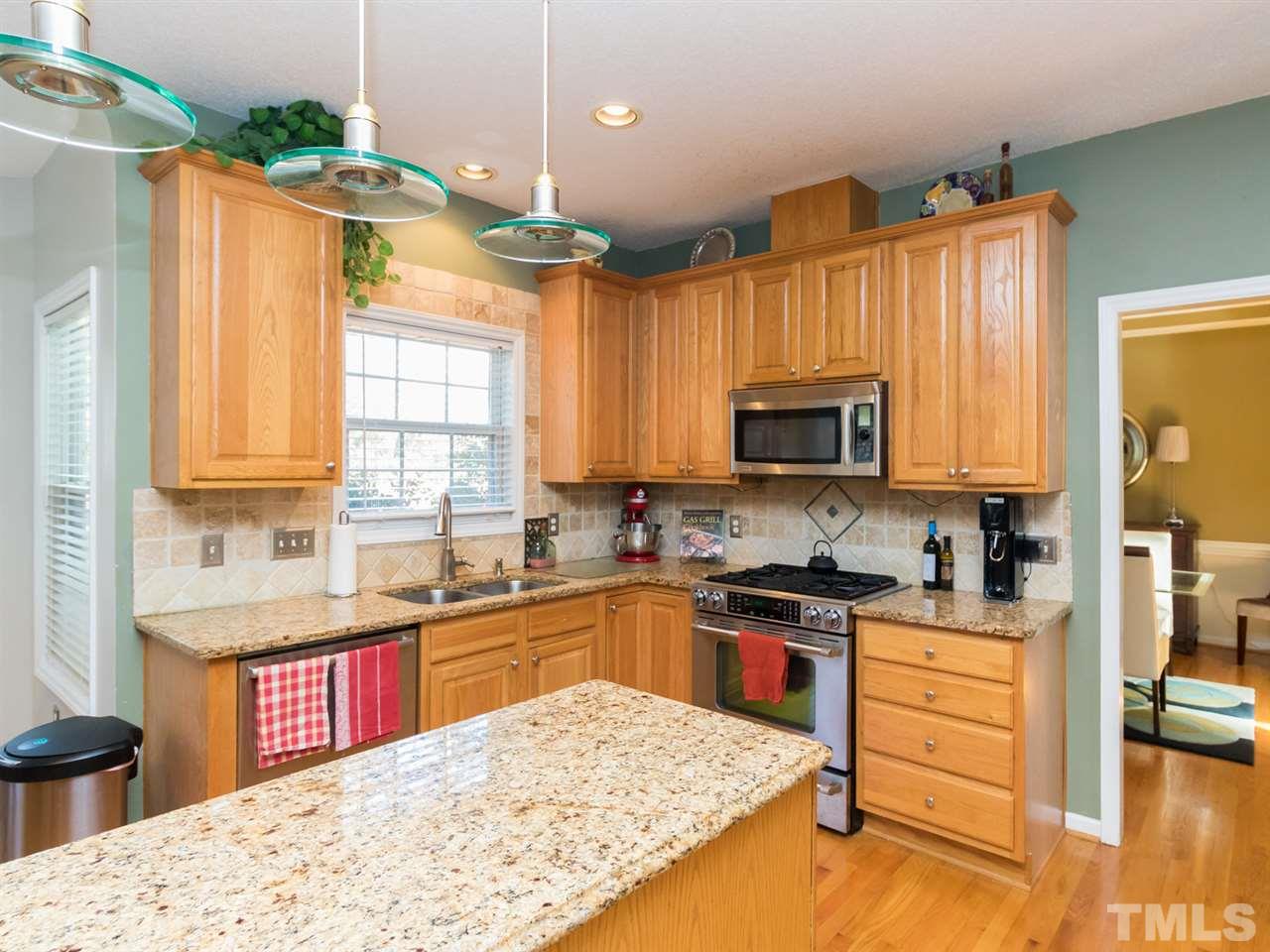 2500 Bulmer Terrace Raleigh, NC 27615 - Photo 7 of 25 a kitchen with a sink stove and refrigerator
