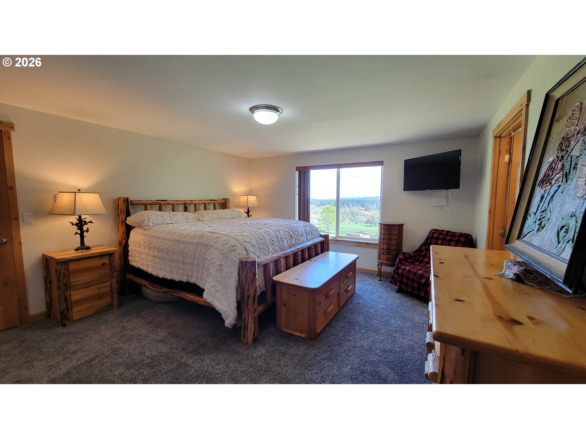 24674 Bolton Hill Road Veneta, OR 97487 - Photo 15 of 35 a living room with furniture and a flat screen tv
