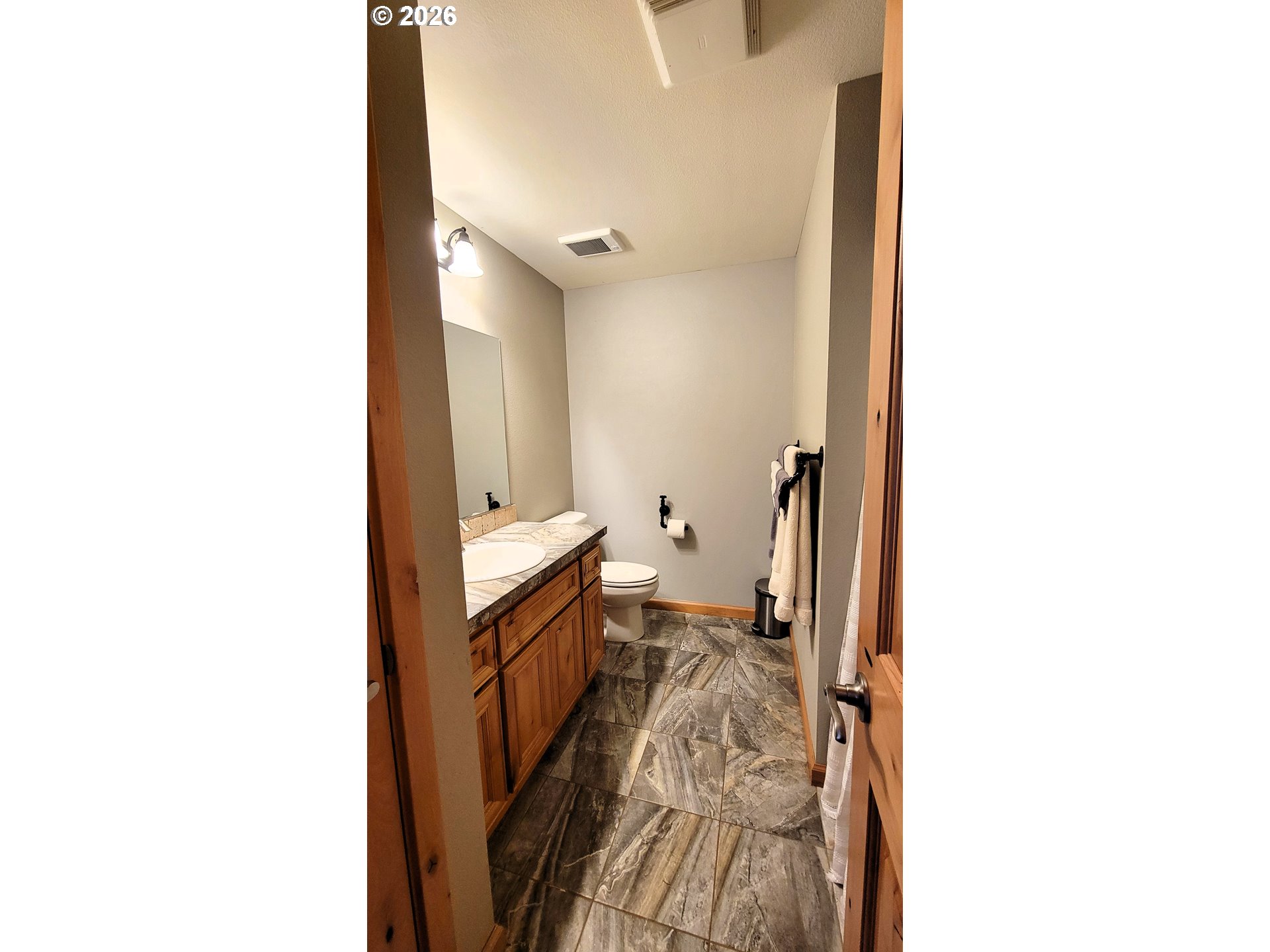 24674 Bolton Hill Road Veneta, OR 97487 - Photo 21 of 35 a view of a hallway with bathroom
