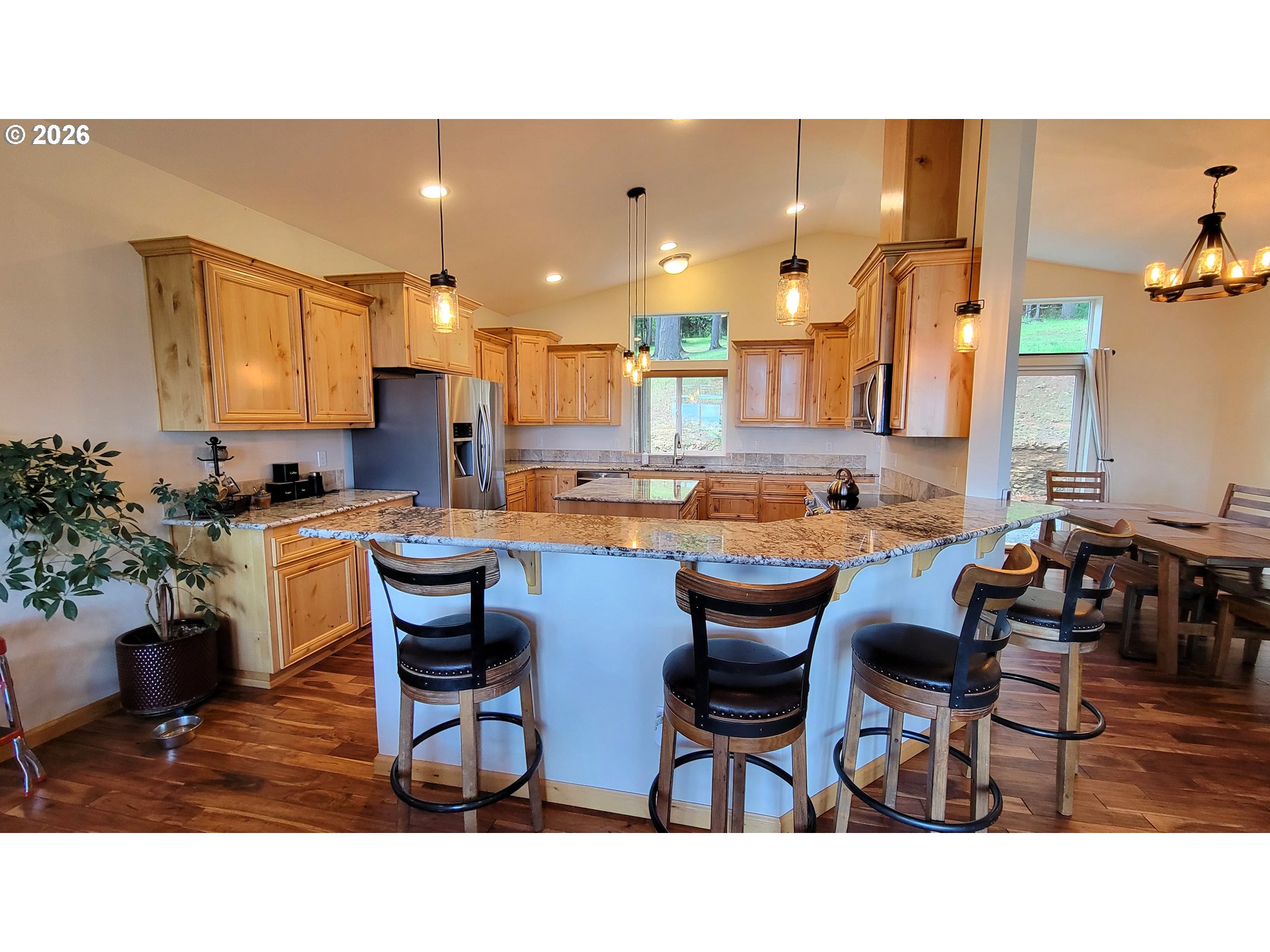 24674 Bolton Hill Road Veneta, OR 97487 - Photo 5 of 35 a kitchen with a dining table chairs and view kitchen