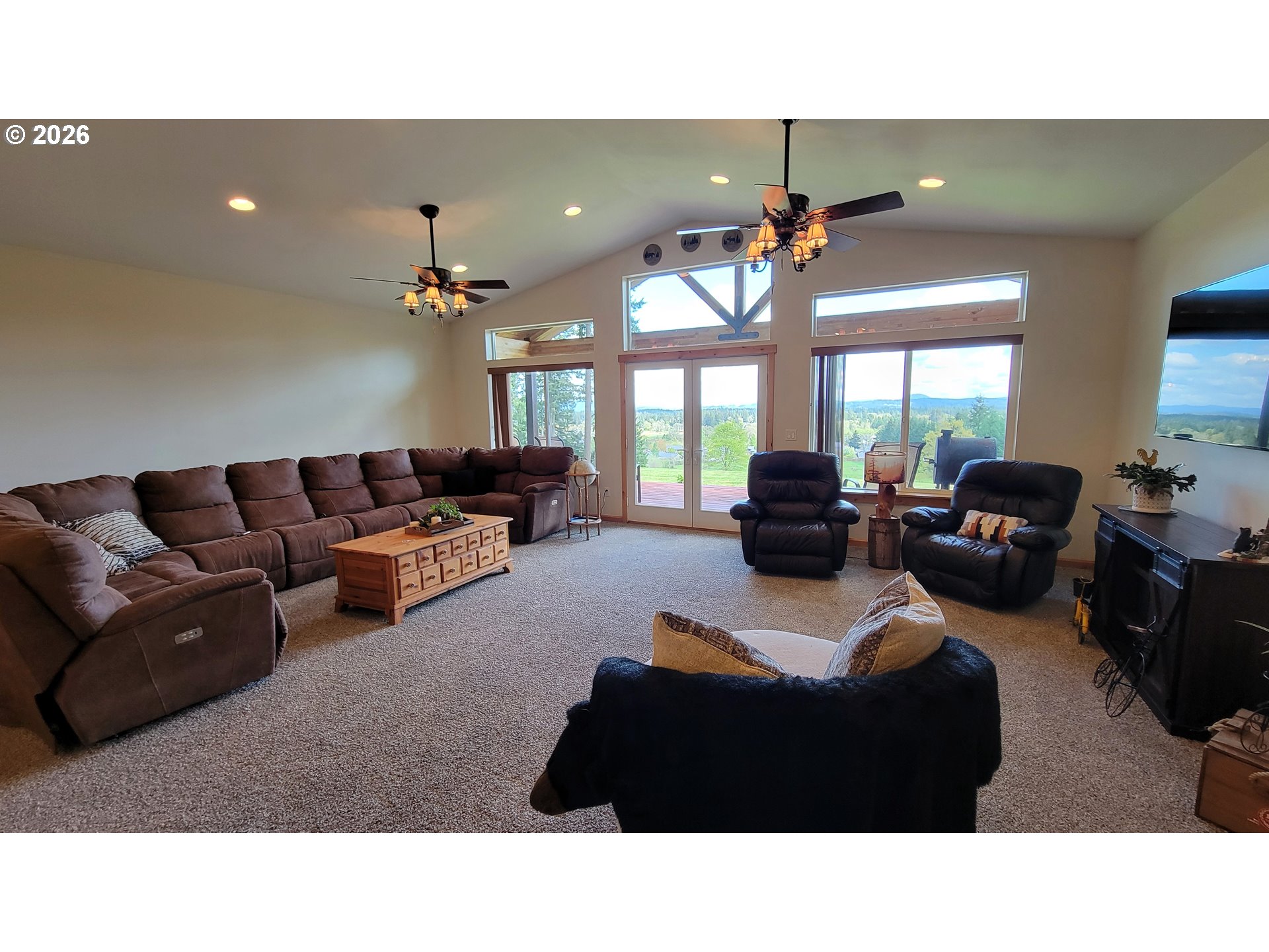 24674 Bolton Hill Road Veneta, OR 97487 - Photo 9 of 35 a living room with furniture and a chandelier