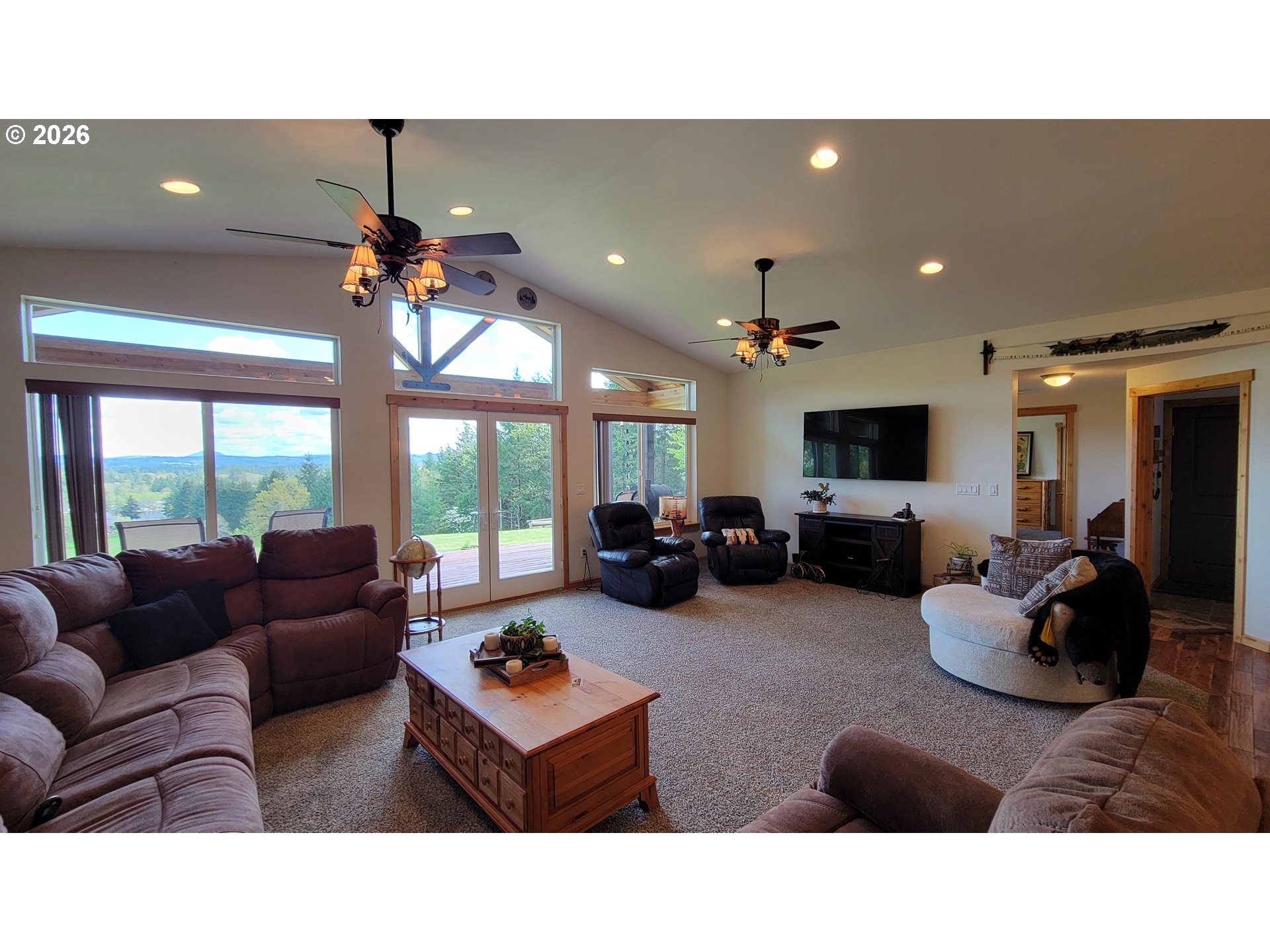 24674 Bolton Hill Road Veneta, OR 97487 - Photo 10 of 35 a living room with furniture and a flat screen tv