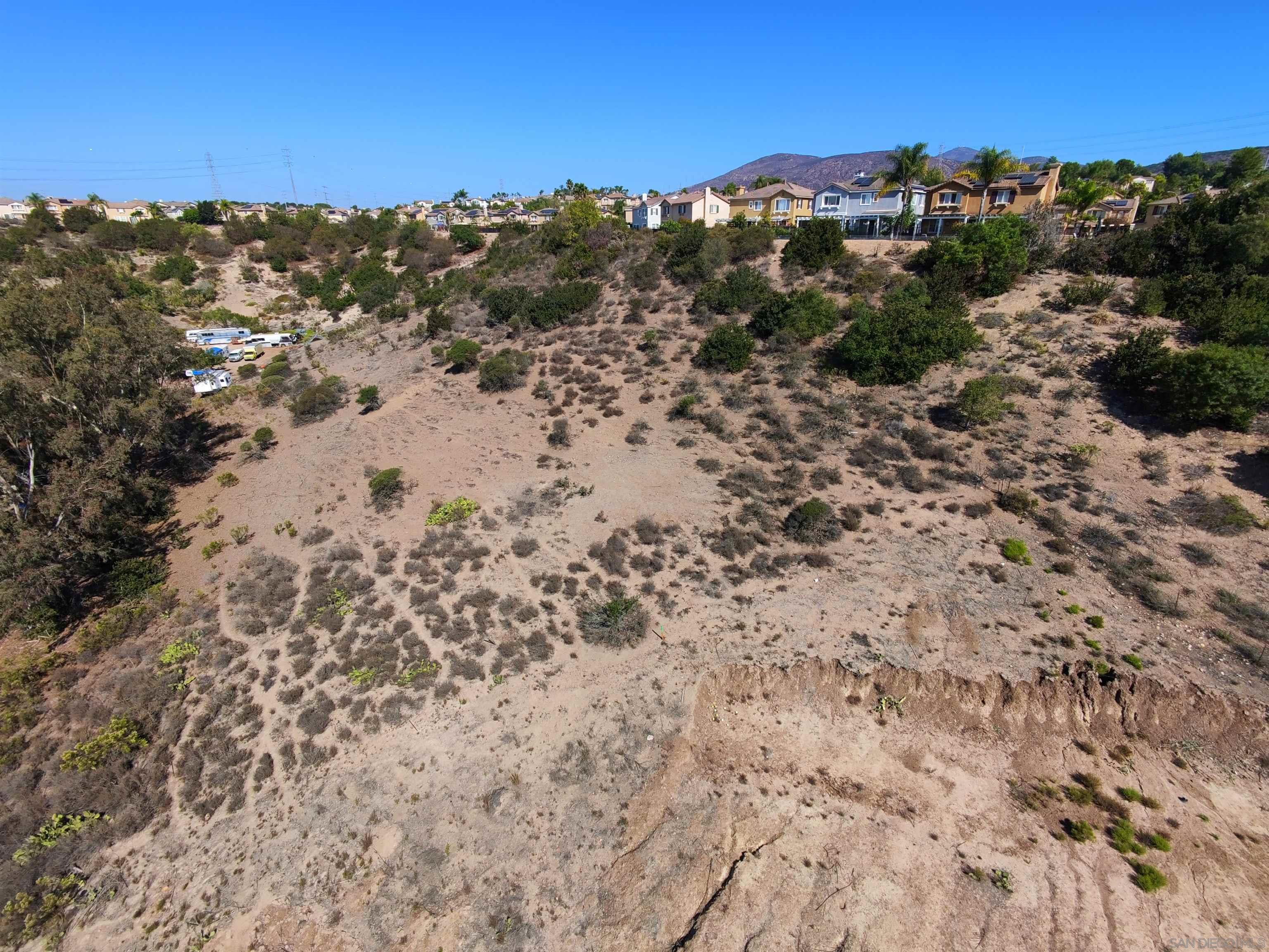 9970 Proctor Valley Road, Unit 3 Chula Vista, CA 91914 - Photo 7 of 9 a view of a beach with mountains in the background