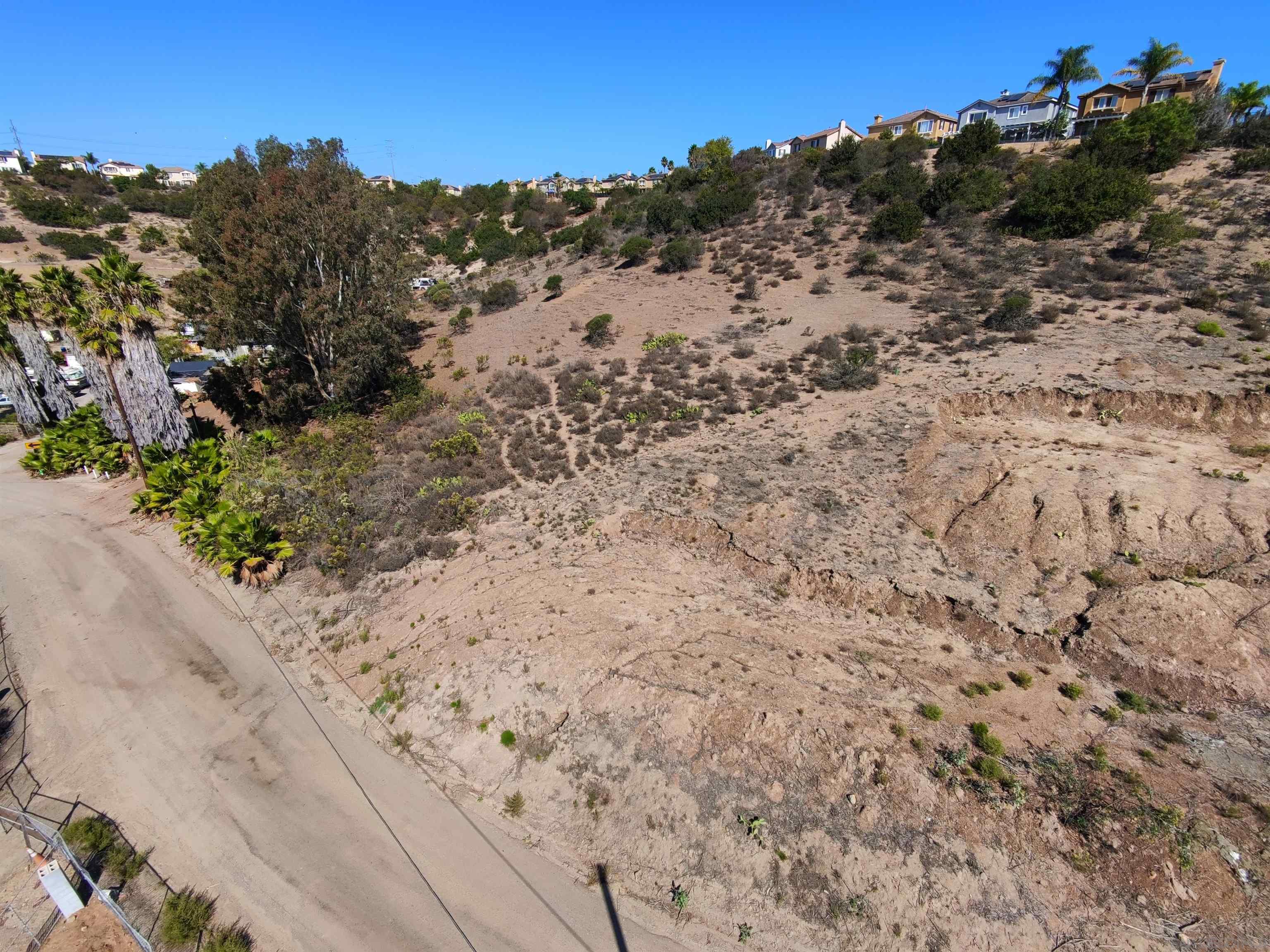 9970 Proctor Valley Road, Unit 3 Chula Vista, CA 91914 - Photo 9 of 9 a view of a dry yard with wooden fence