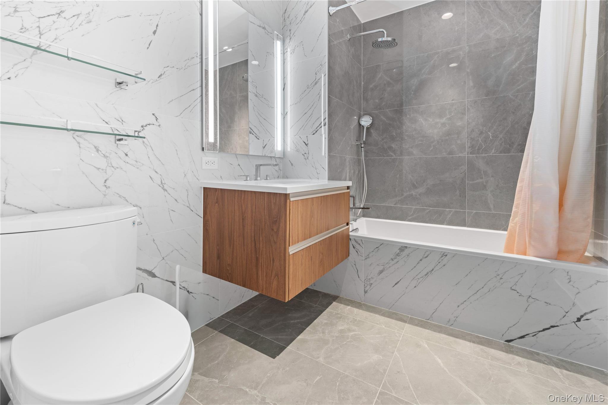 136-18 Maple Avenue, Unit 5G Queens, NY 11355 - Photo 13 of 35 a bathroom with a sink a toilet and shower