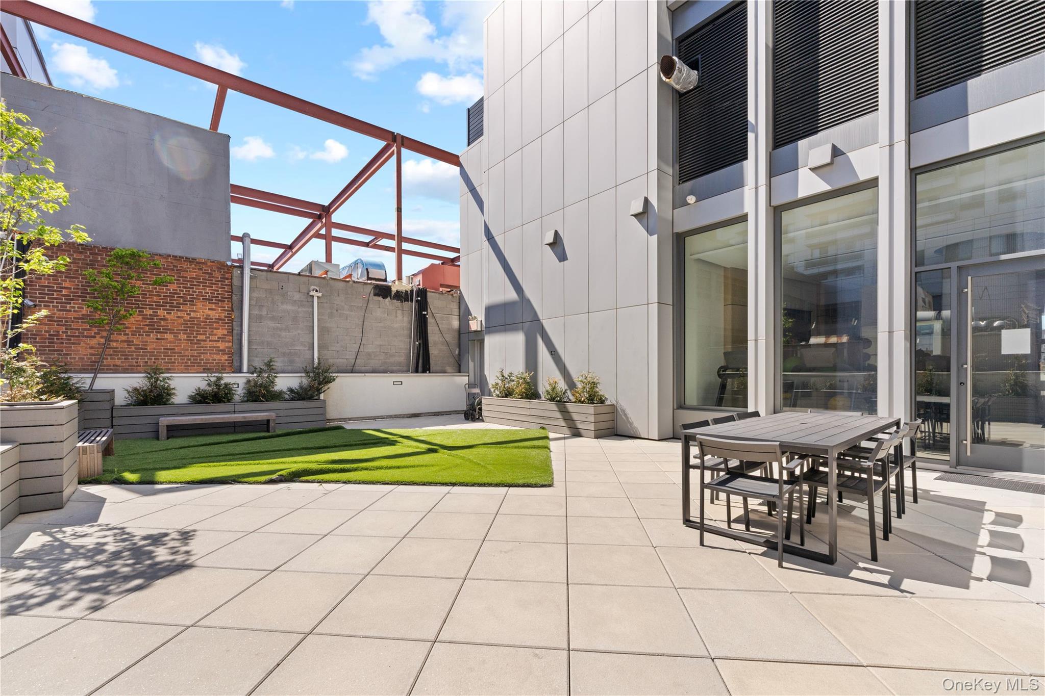 136-18 Maple Avenue, Unit 5G Queens, NY 11355 - Photo 25 of 35 a view of a swimming pool with furniture