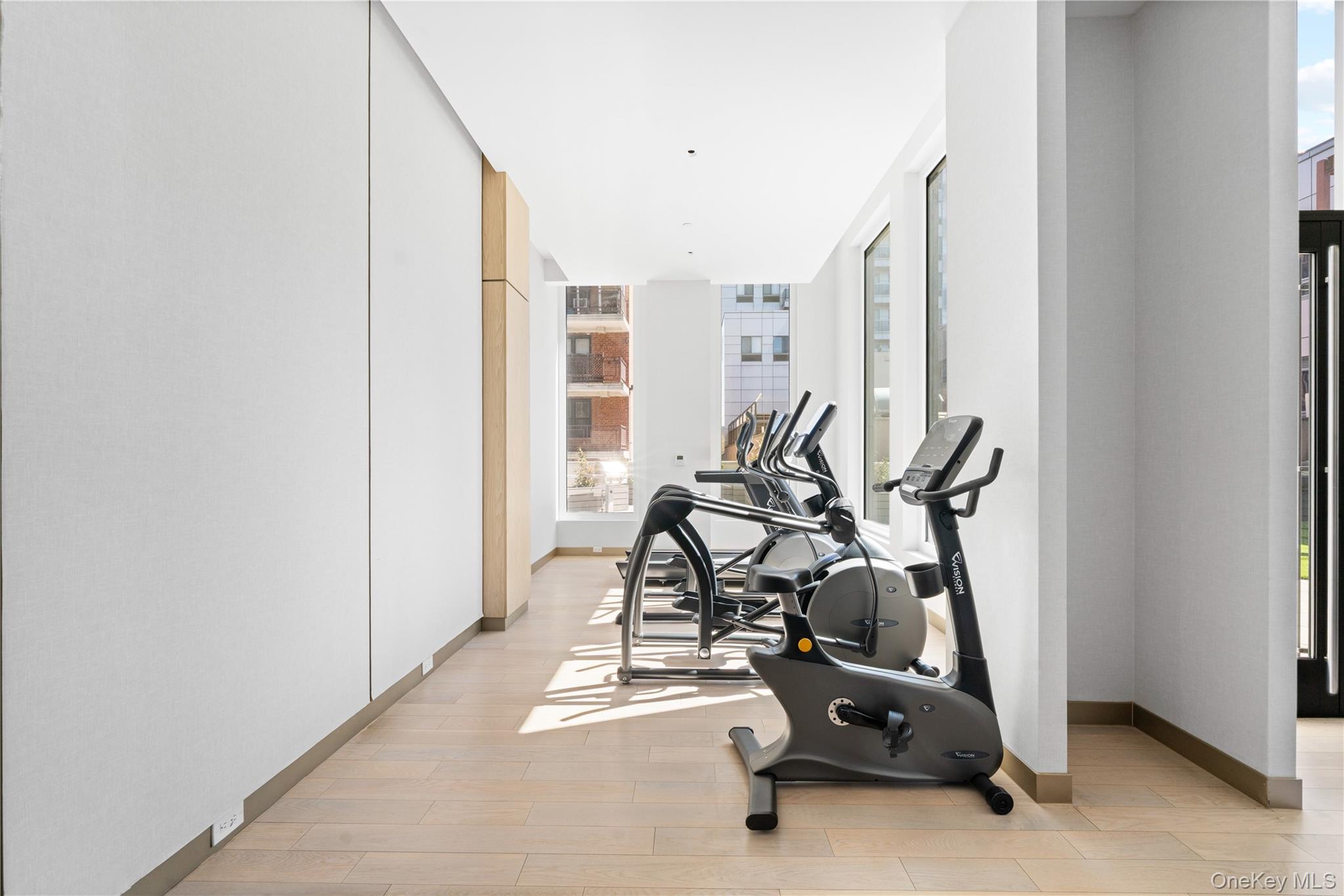 136-18 Maple Avenue, Unit 5G Queens, NY 11355 - Photo 28 of 35 a view of a room with gym equipment