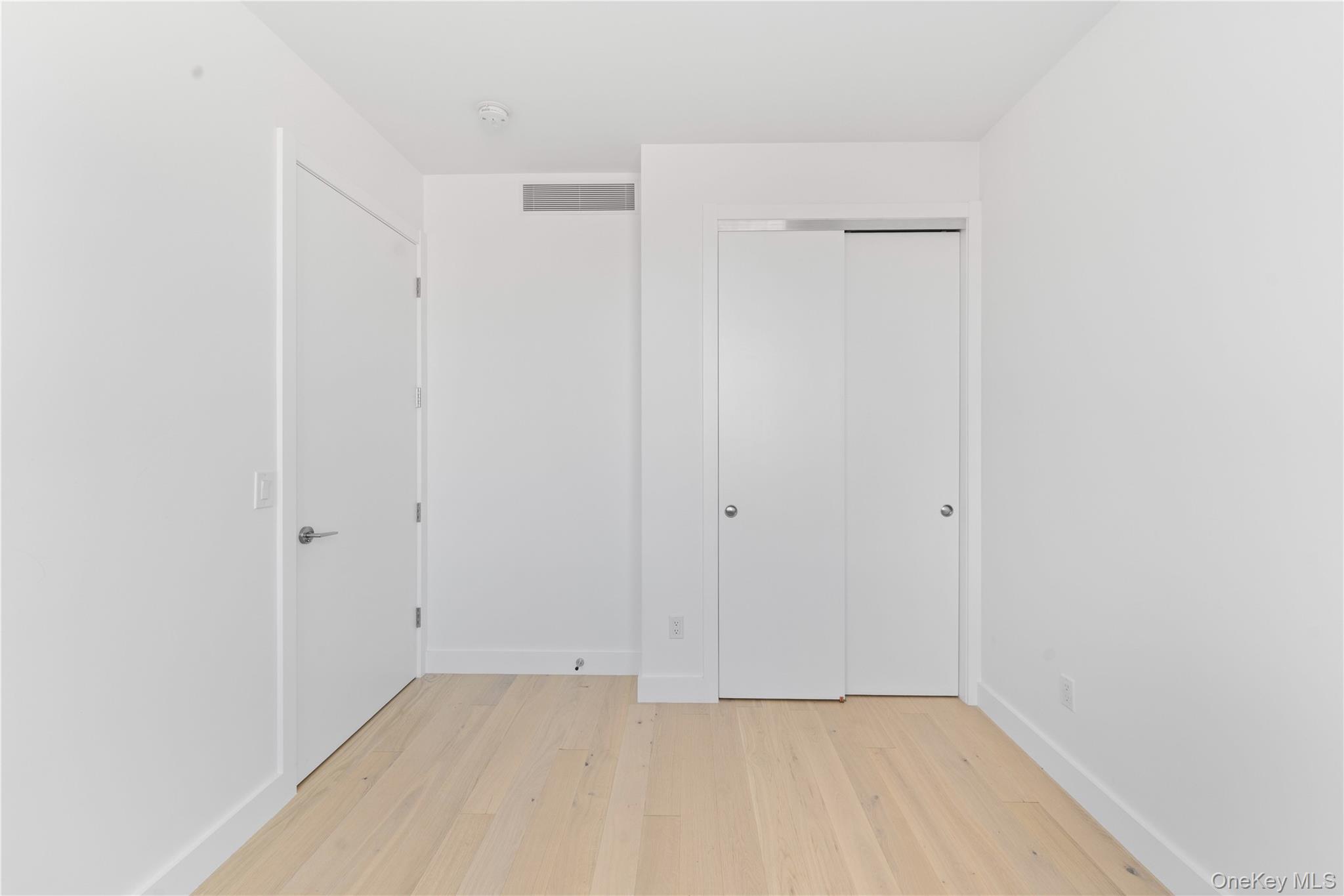 136-18 Maple Avenue, Unit 5G Queens, NY 11355 - Photo 6 of 35 a view of an empty room