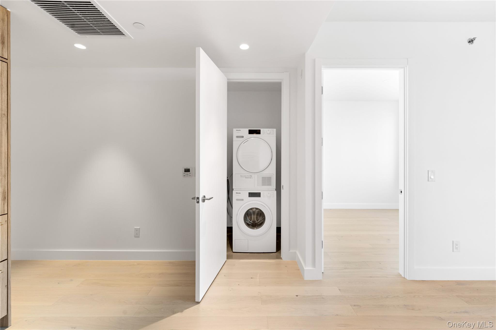 136-18 Maple Avenue, Unit 5G Queens, NY 11355 - Photo 8 of 35 a view of a bathroom with mirror