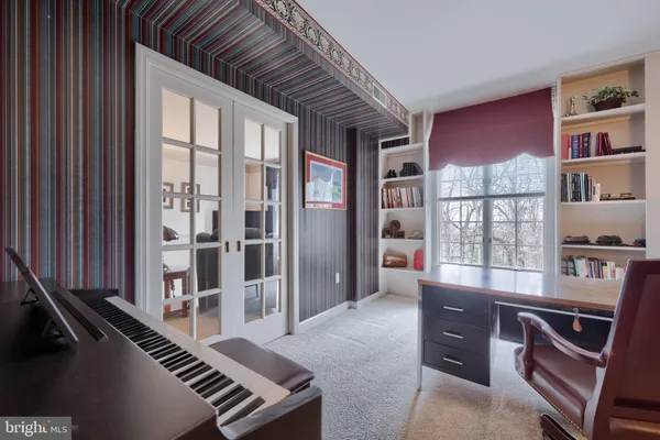 a kitchen with a table chairs and microwave