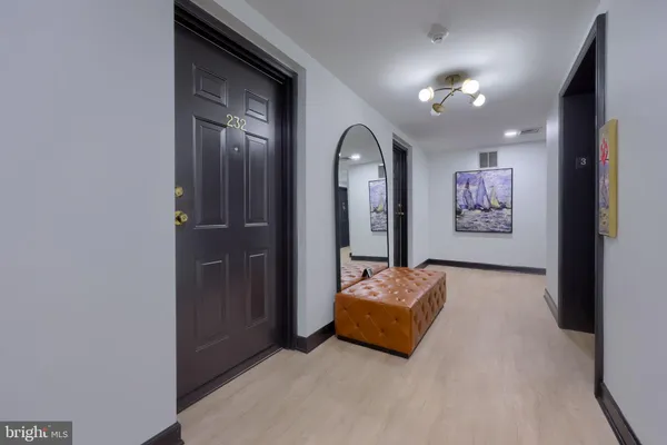a view of a livingroom with furniture and a flat screen tv