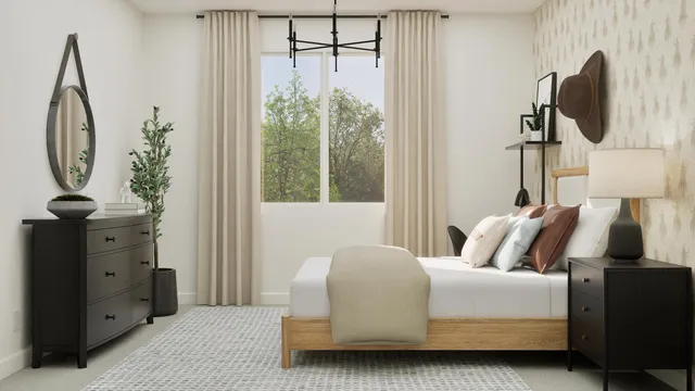 a bedroom with a bed and a mirror