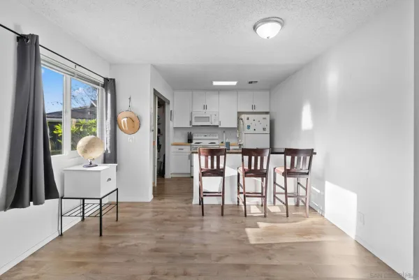 a kitchen with sink and cabinets