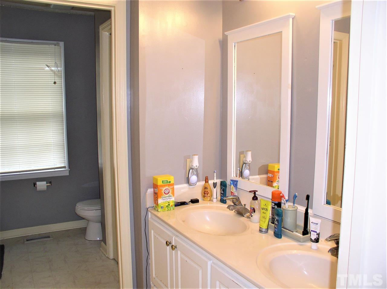 1337 Robertson Road Roxboro, NC 27574 - Photo 10 of 19 Washer/dryer closet in second full bathroom
