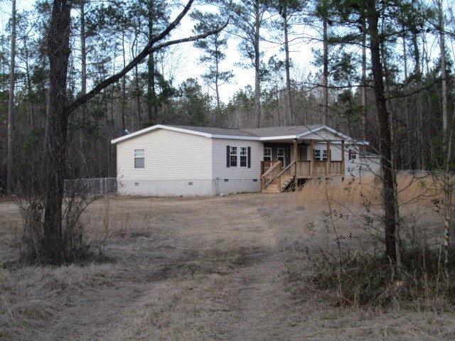 180 Davis Road Gray, GA 31032 - Photo 29 of 29 a view of house with backyard and trees