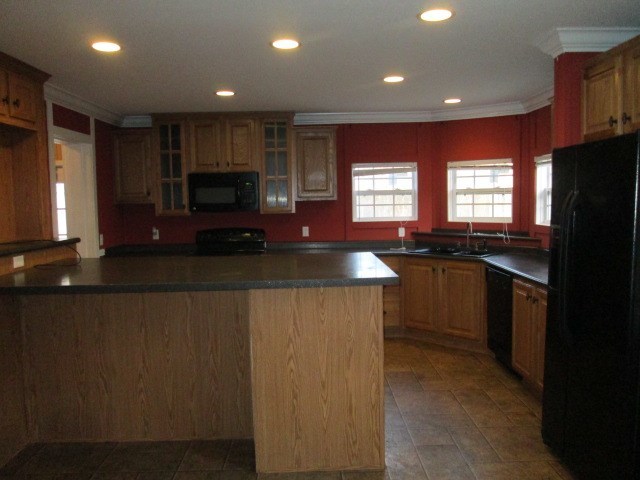 180 Davis Road Gray, GA 31032 - Photo 8 of 29 a kitchen with stainless steel appliances granite countertop a stove a sink and a refrigerator
