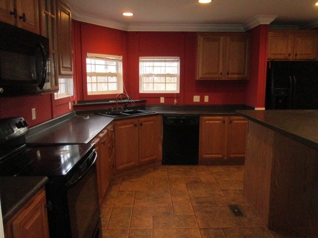 180 Davis Road Gray, GA 31032 - Photo 9 of 29 a kitchen with a sink stove and microwave
