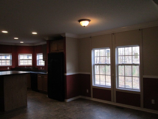 180 Davis Road Gray, GA 31032 - Photo 10 of 29 a kitchen with a refrigerator and window