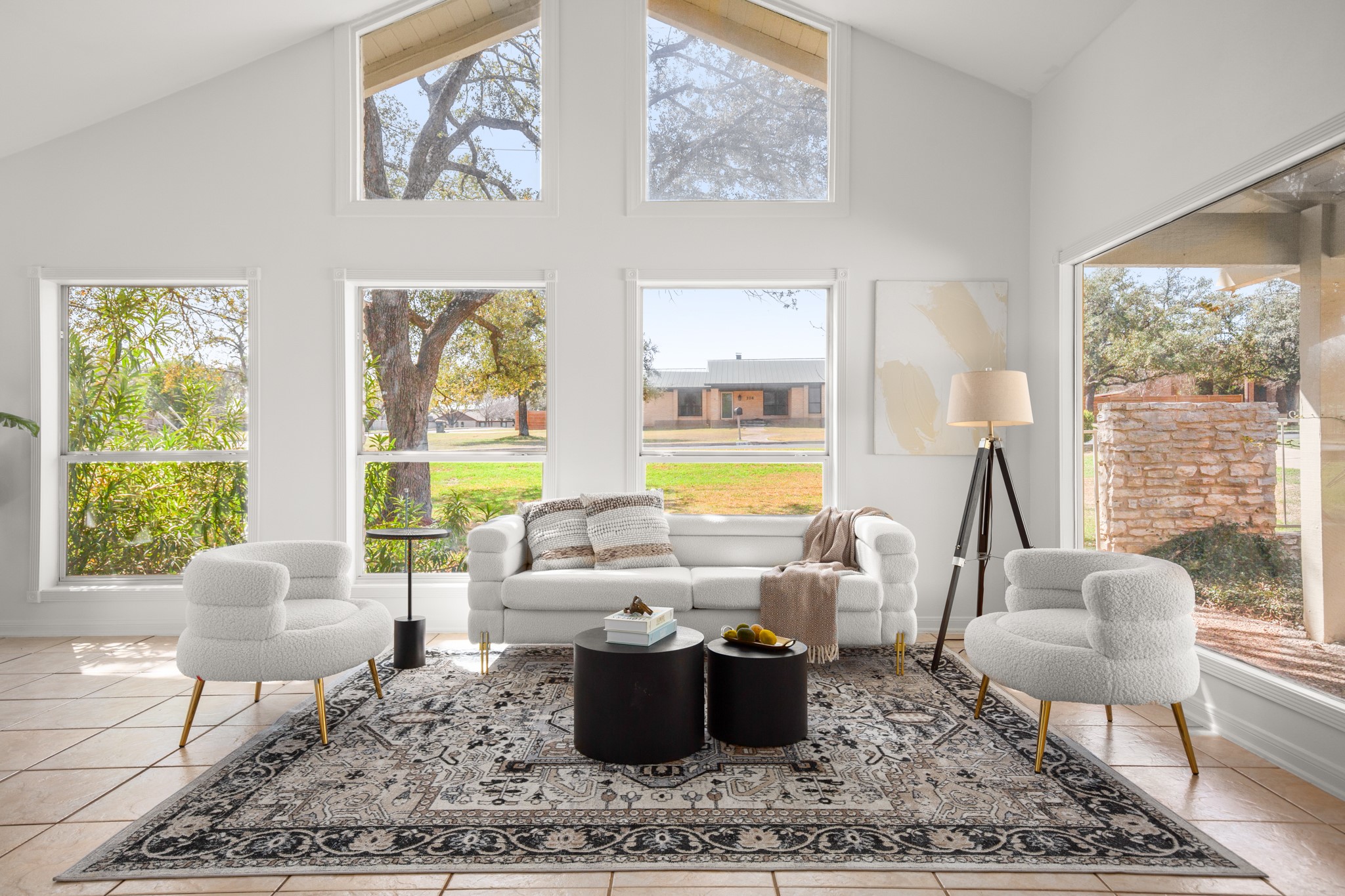 209 Ridgecrest Road Georgetown, TX 78628 - Photo 12 of 40 Step inside to find a gorgeous formal living room under soaring vaulted ceilings with stacked windows, amazing natural light, and excellent flexibility for use of space.