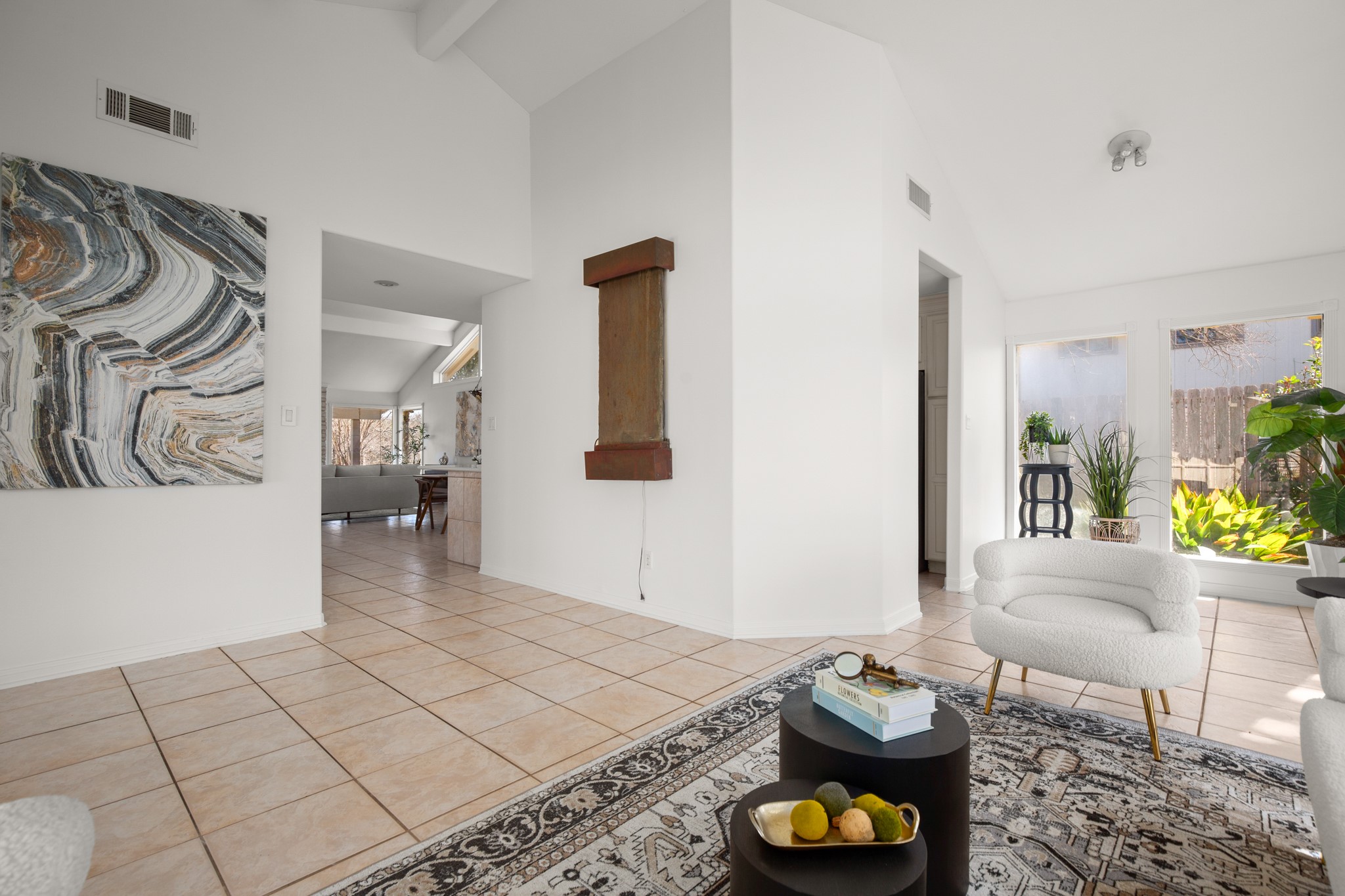 209 Ridgecrest Road Georgetown, TX 78628 - Photo 13 of 40 The entry foyer and living room flow into the main living area and kitchen while adding a nice separation of spaces.