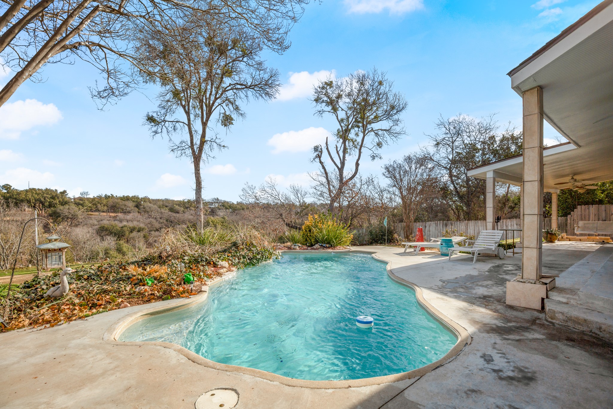209 Ridgecrest Road Georgetown, TX 78628 - Photo 2 of 40 Stunning entertainer's outdoor oasis with an in ground pool, wrap around covered patios, and long distance tree top views with sounds of the San Gabriel below.