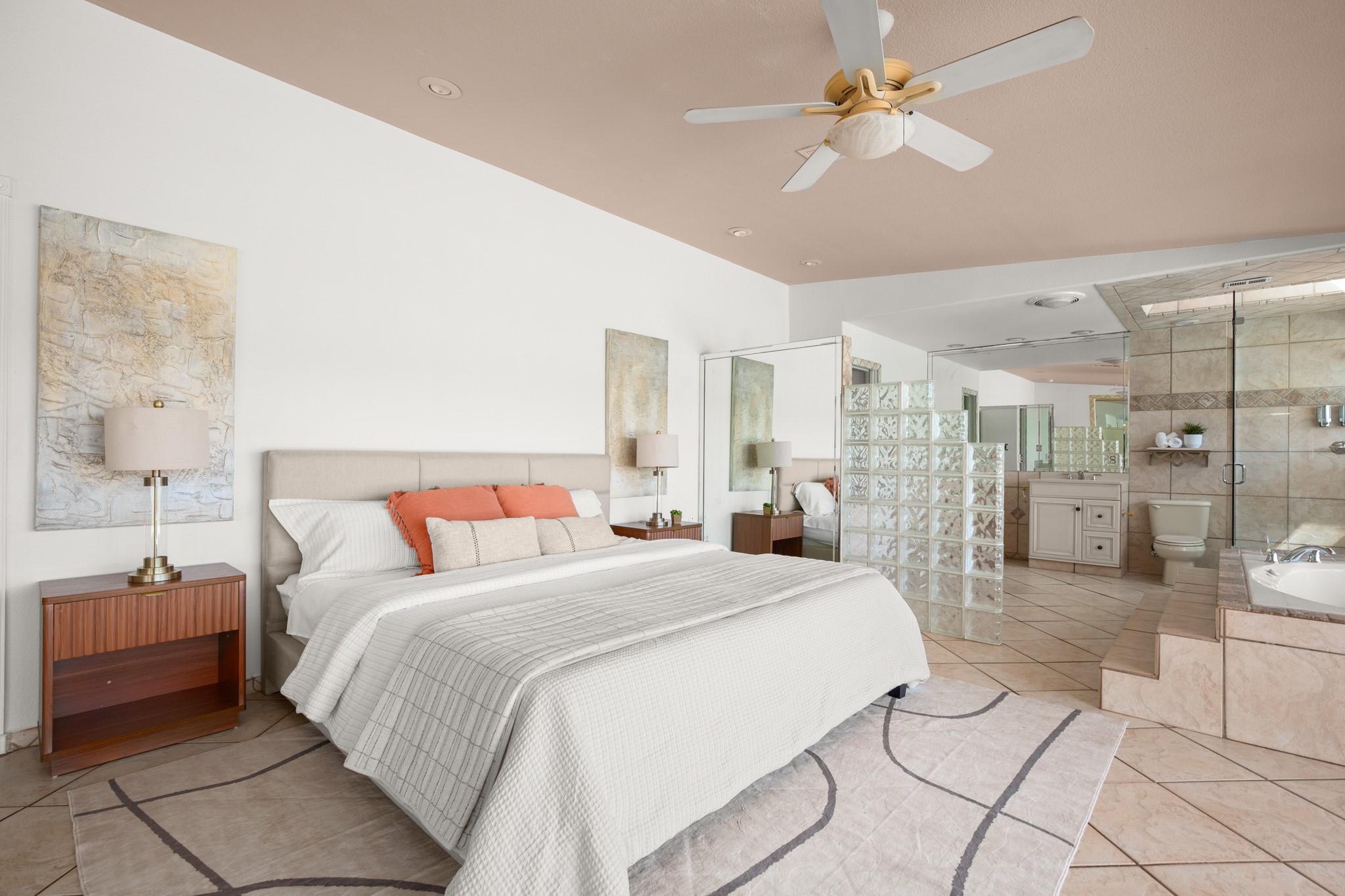 209 Ridgecrest Road Georgetown, TX 78628 - Photo 22 of 40 Ample vintage 80s charm with the room partially open to the ensuite bath and glass cube privacy divider.