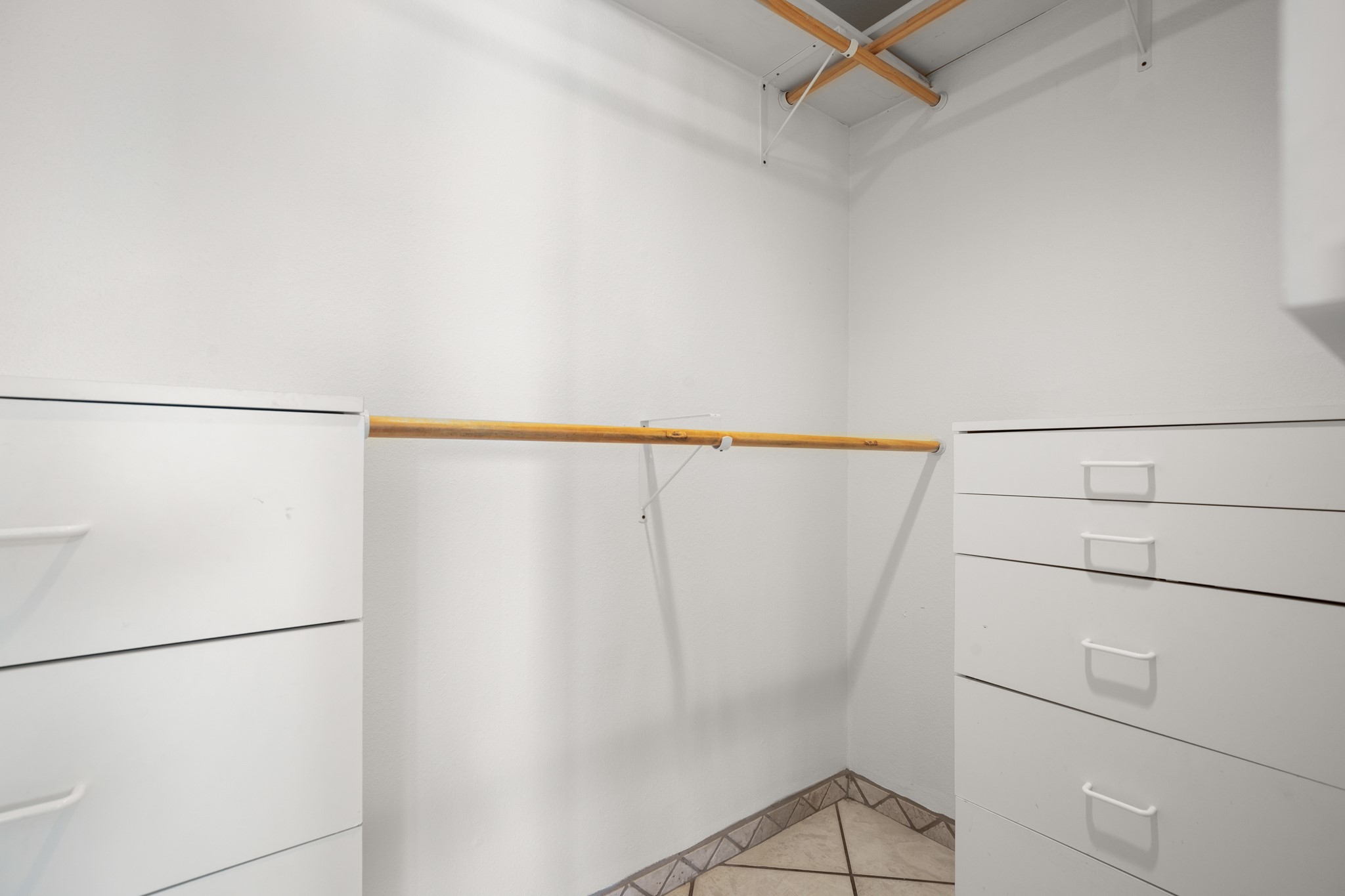 209 Ridgecrest Road Georgetown, TX 78628 - Photo 26 of 40 The primary walk-in closet is nice and spacious with convenient built-in dressers.