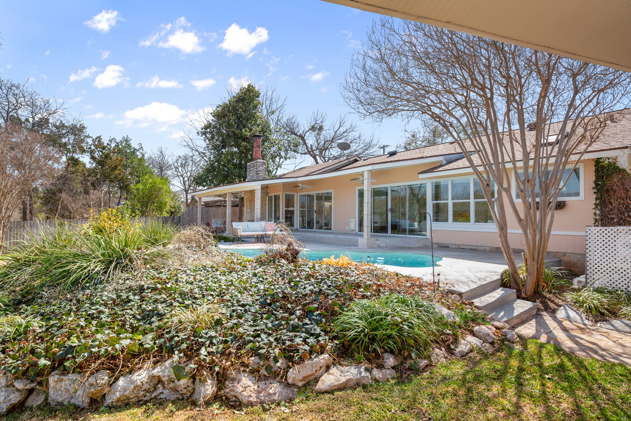 209 Ridgecrest Road Georgetown, TX 78628 - Photo 32 of 40 Lush mature landscaping surrounds the pool deck making it feel like a true oasis.