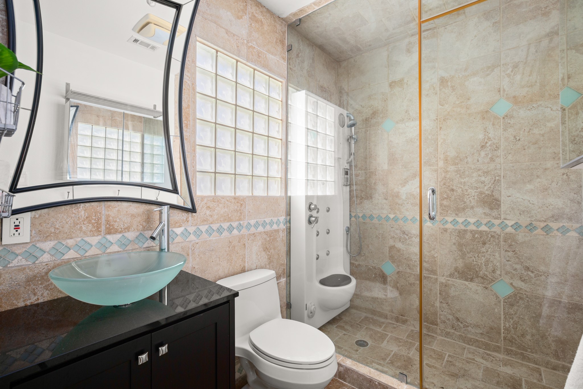 209 Ridgecrest Road Georgetown, TX 78628 - Photo 36 of 40 There's also a stylish modern full bath in the guest house complete with a spa-like frameless glass walk-in shower with a deluxe massage jet system.