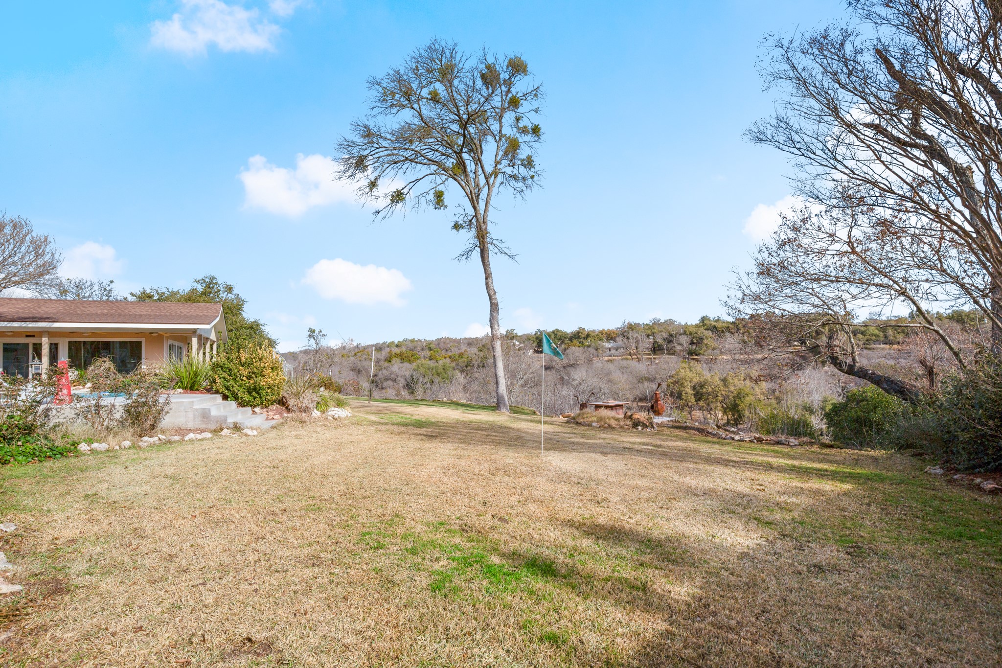 209 Ridgecrest Road Georgetown, TX 78628 - Photo 4 of 40 A sprawling fenced-in yard surrounds the home, leading to the cliff's edge with the scenic river below - well above the flood zone.