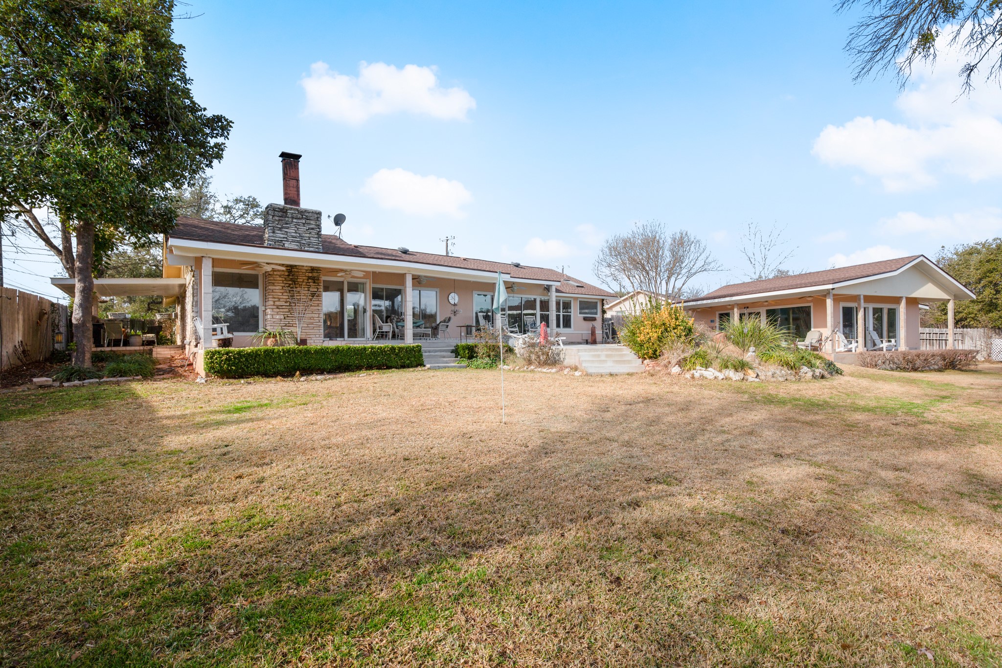 209 Ridgecrest Road Georgetown, TX 78628 - Photo 6 of 40 The main home and casita frame the pool with covered porches for shaded outdoor relaxation while the spacious yard provides room for play and pets.