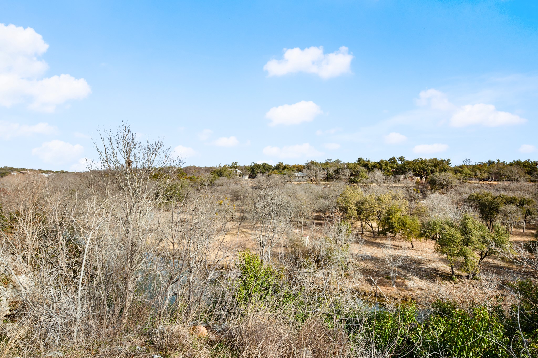 209 Ridgecrest Road Georgetown, TX 78628 - Photo 7 of 40 A a fire pit area at the back of the yard provides space for setting up some comfortable chairs where you can watch the river flow below and roast s'mores under the stars.