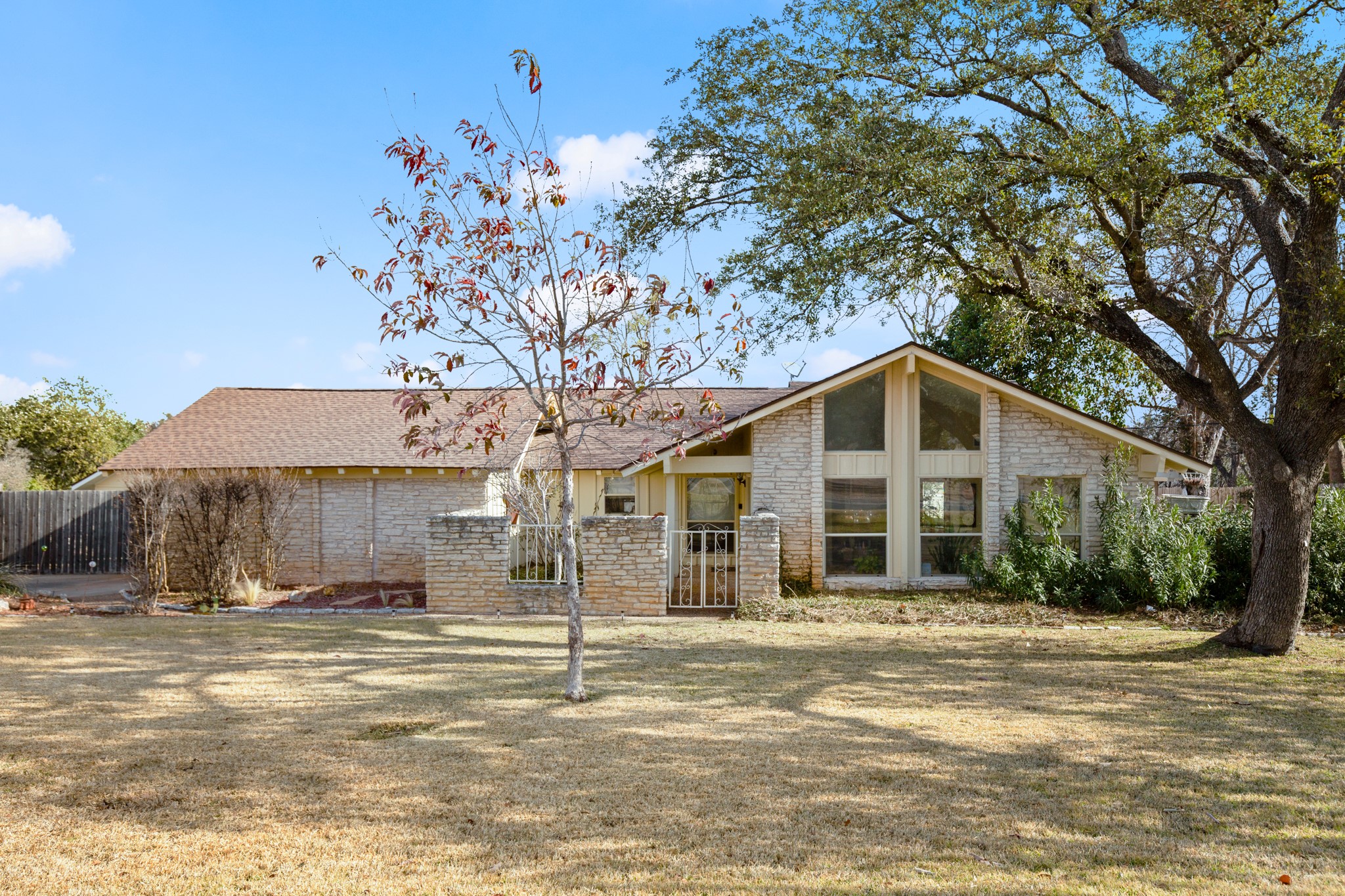209 Ridgecrest Road Georgetown, TX 78628 - Photo 10 of 40 The home is surrounded by fully irrigated front and backyards, mature landscaping, and flourishing shade trees.