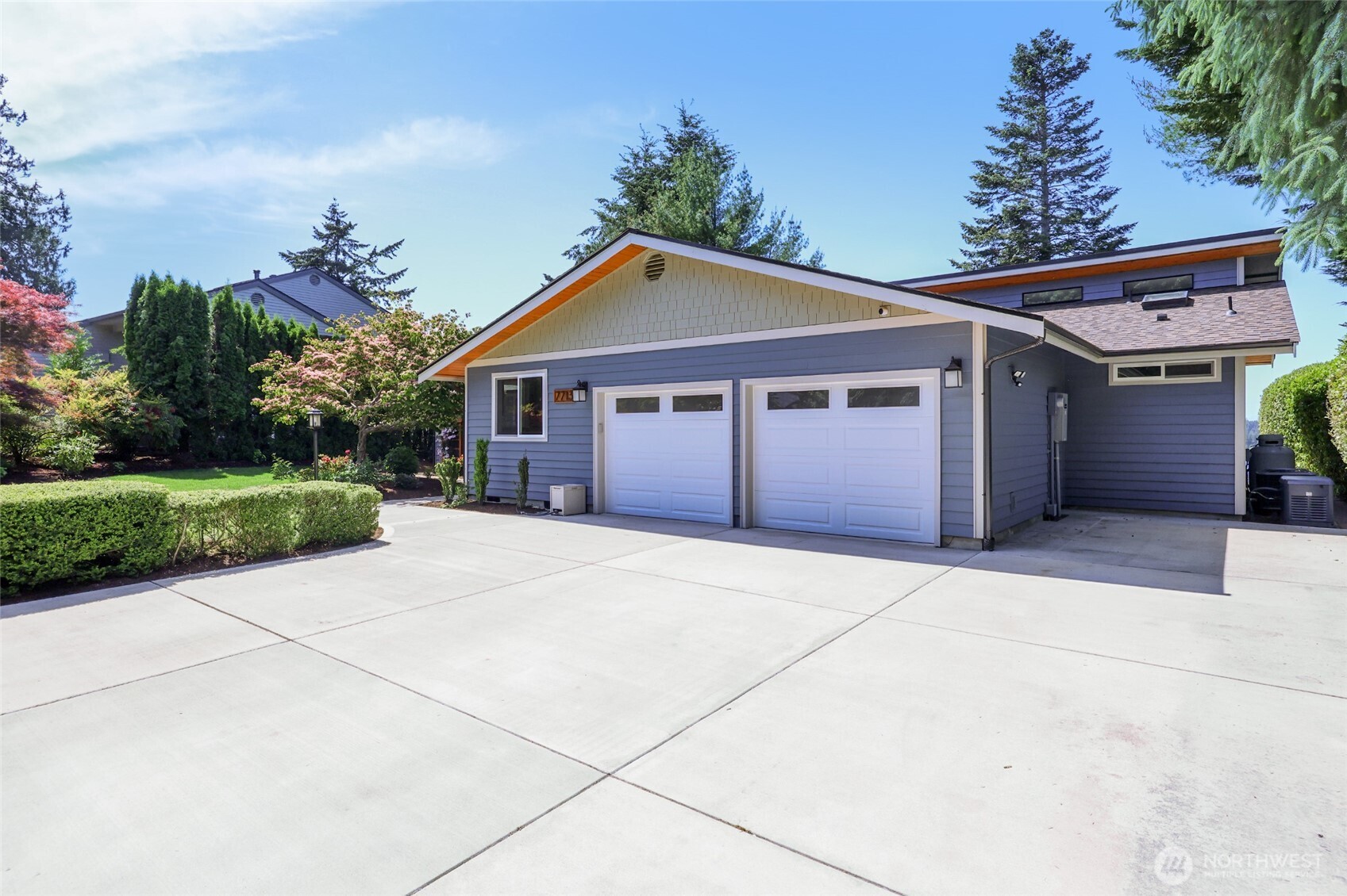 7713 78th Loop Northwest Olympia, WA 98502 - Photo 33 of 40 a front view of a house with a yard and garage