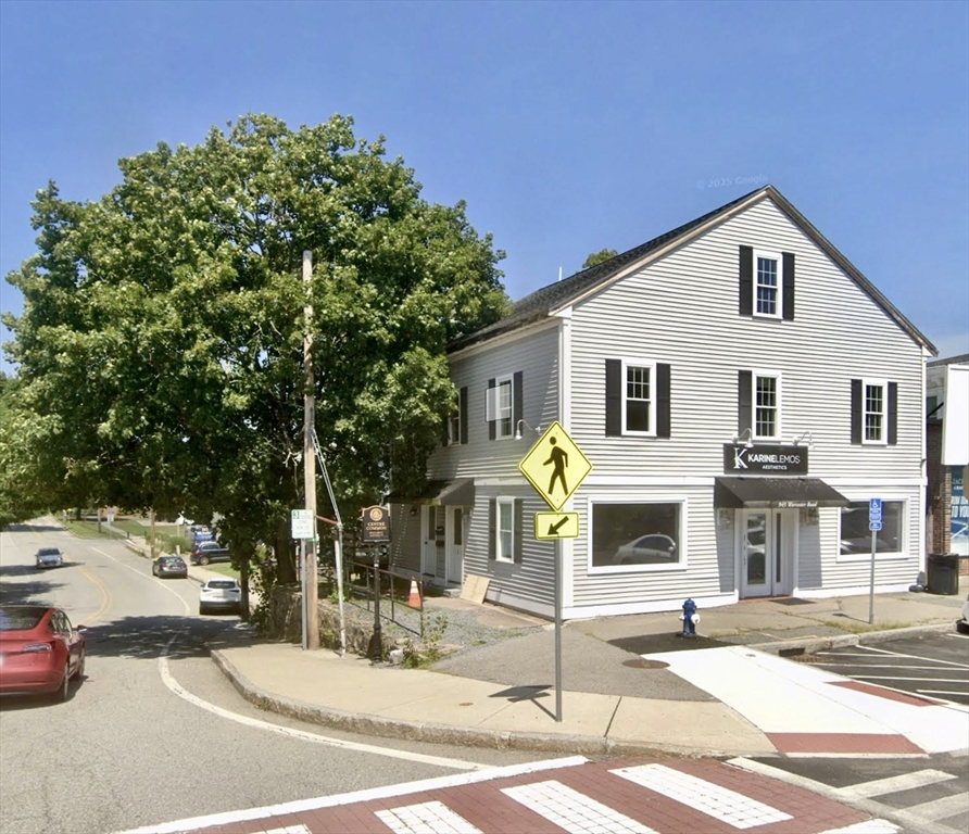 1 Vernon Street, Unit 1 Framingham, MA 01701 - Photo 1 of 1 a front view of a house with a garden and tree