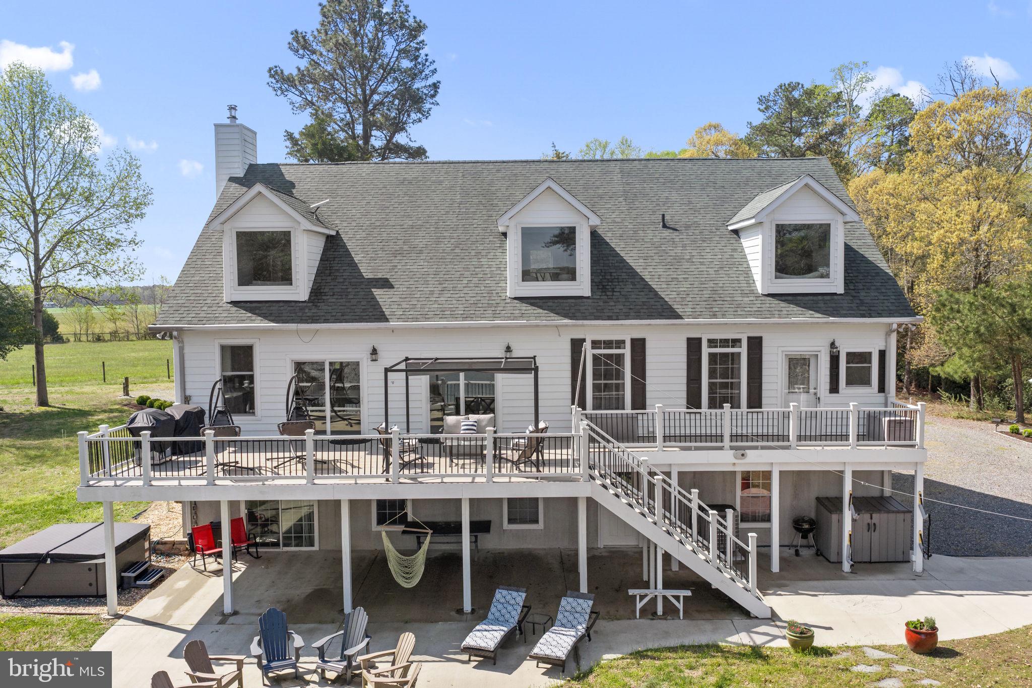 249 Spring Hill Road Lancaster, VA 22503 - Photo 4 of 65 a aerial view of a house with swimming pool and sitting area