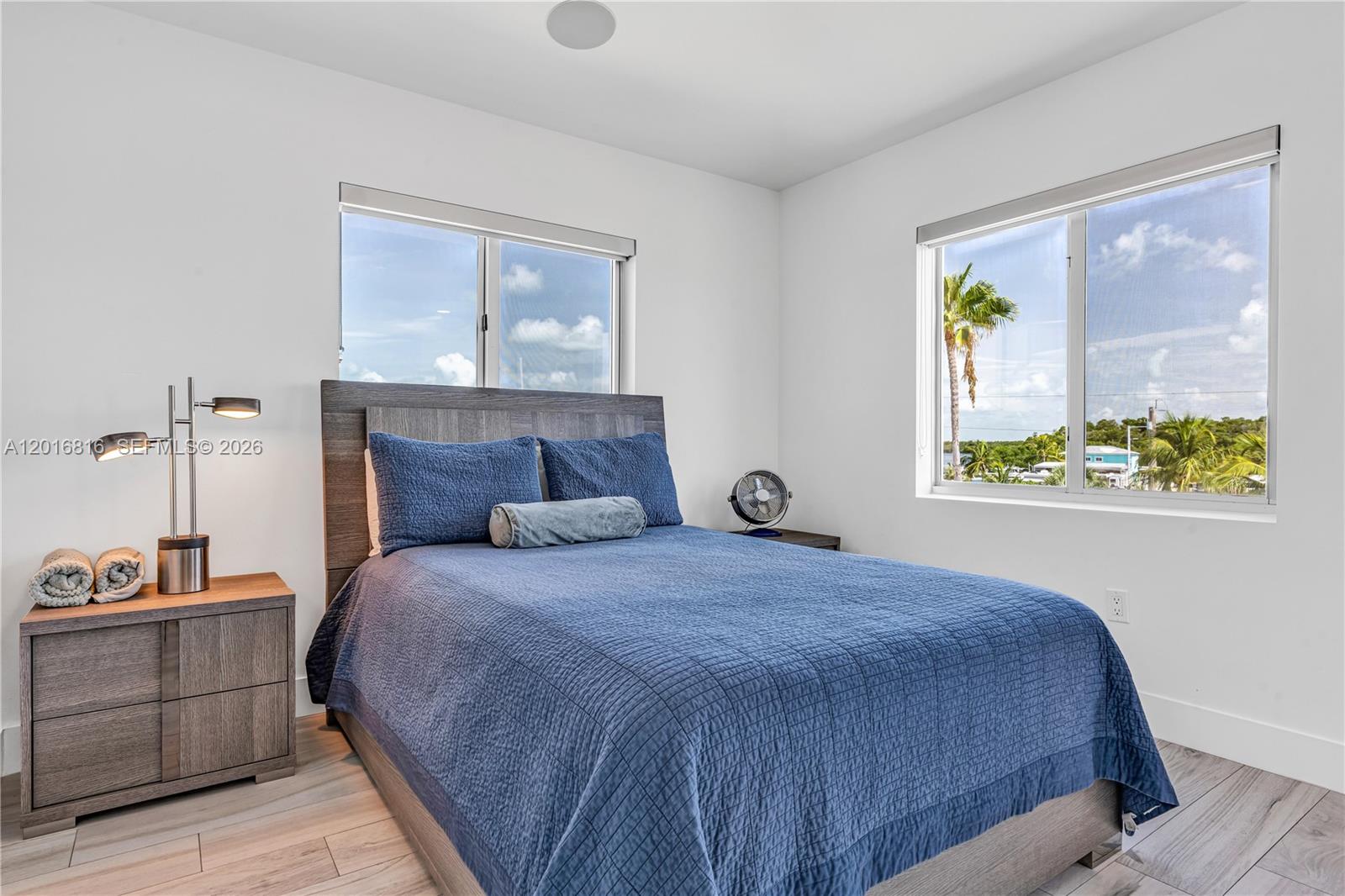 325 Calusa Key Largo, FL 33037 - Photo 12 of 32 a bedroom with a bed and a window