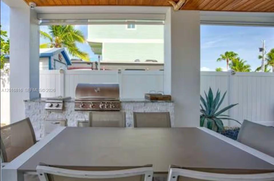 325 Calusa Key Largo, FL 33037 - Photo 21 of 32 a living room with furniture and a potted plant