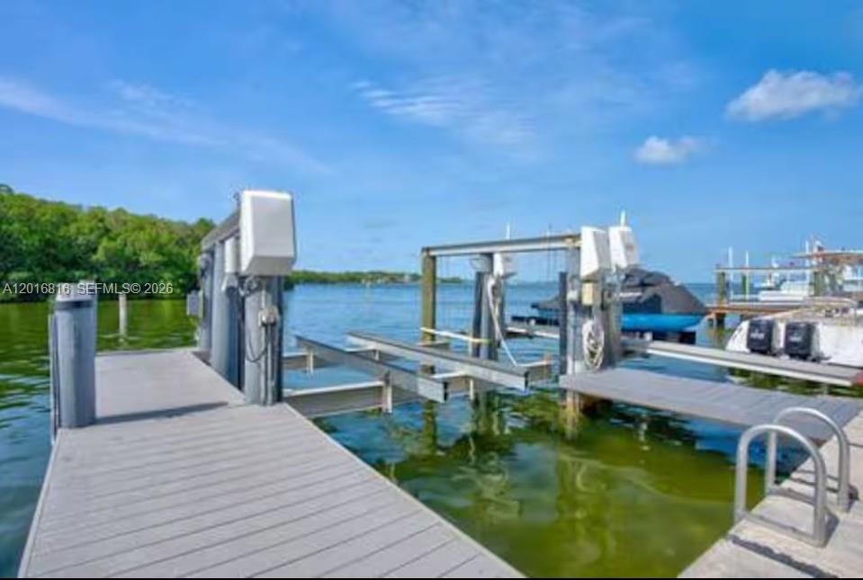 325 Calusa Key Largo, FL 33037 - Photo 22 of 32 a swimming pool with outdoor seating and city view