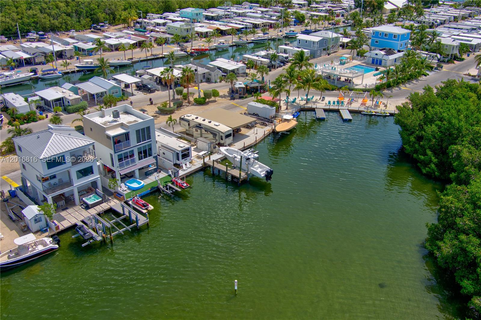 325 Calusa Key Largo, FL 33037 - Photo 29 of 32 an aerial view of residential houses with outdoor space and lake view