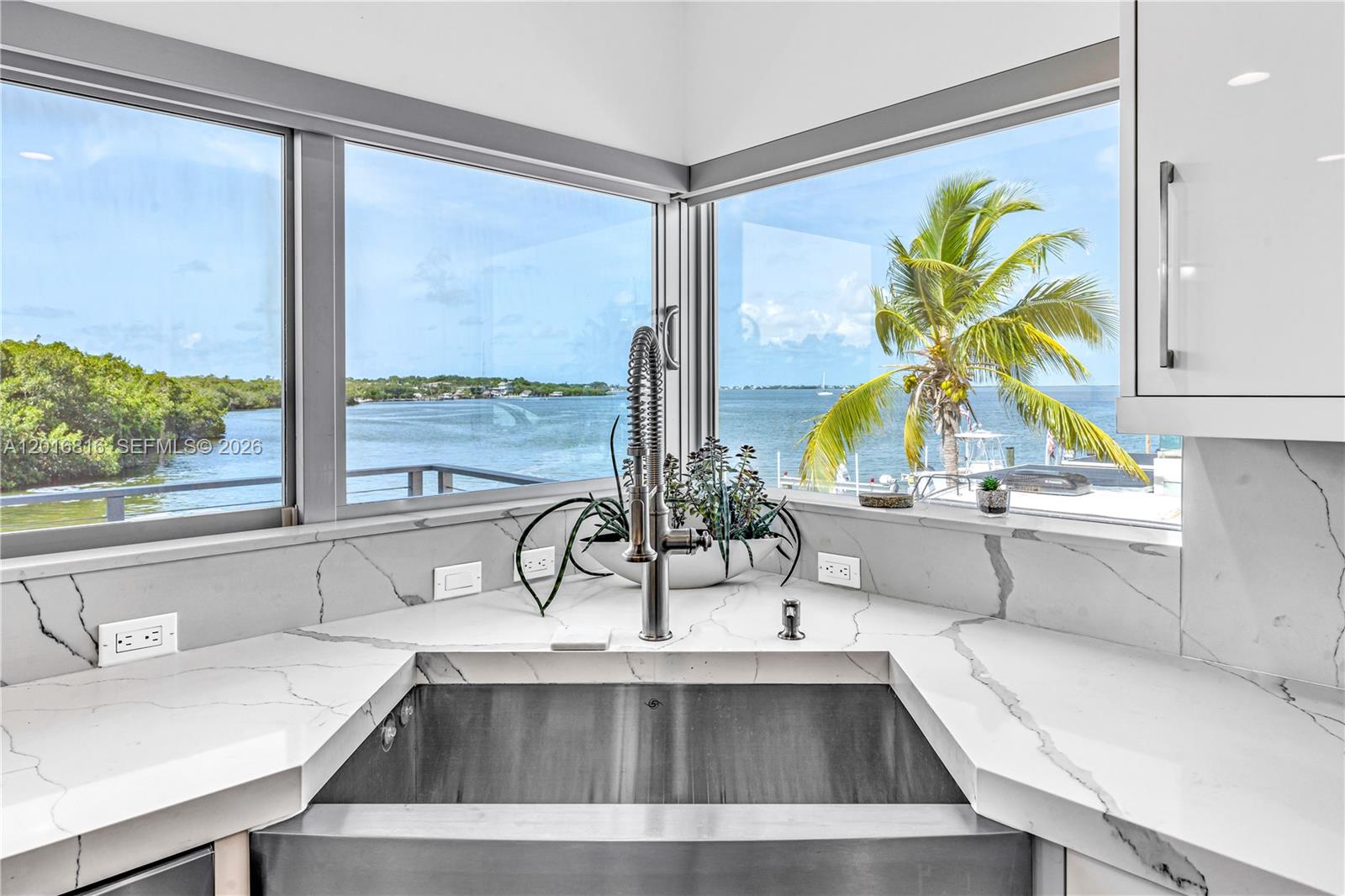 325 Calusa Key Largo, FL 33037 - Photo 4 of 32 a view of kitchen sink and natural light
