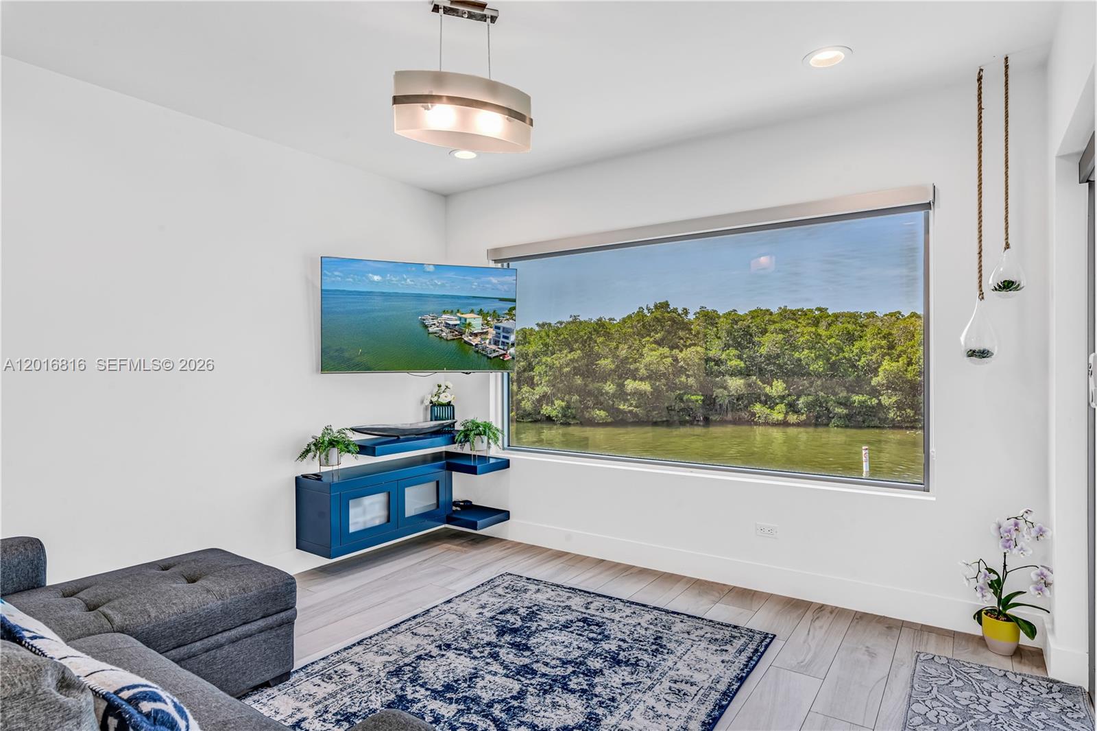 325 Calusa Key Largo, FL 33037 - Photo 7 of 32 a living room with a couch and a window
