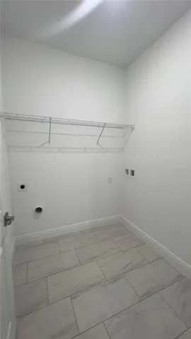 a bathroom with a granite countertop toilet sink and mirror