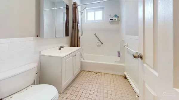 a bathroom with a sink a toilet and a bathtub