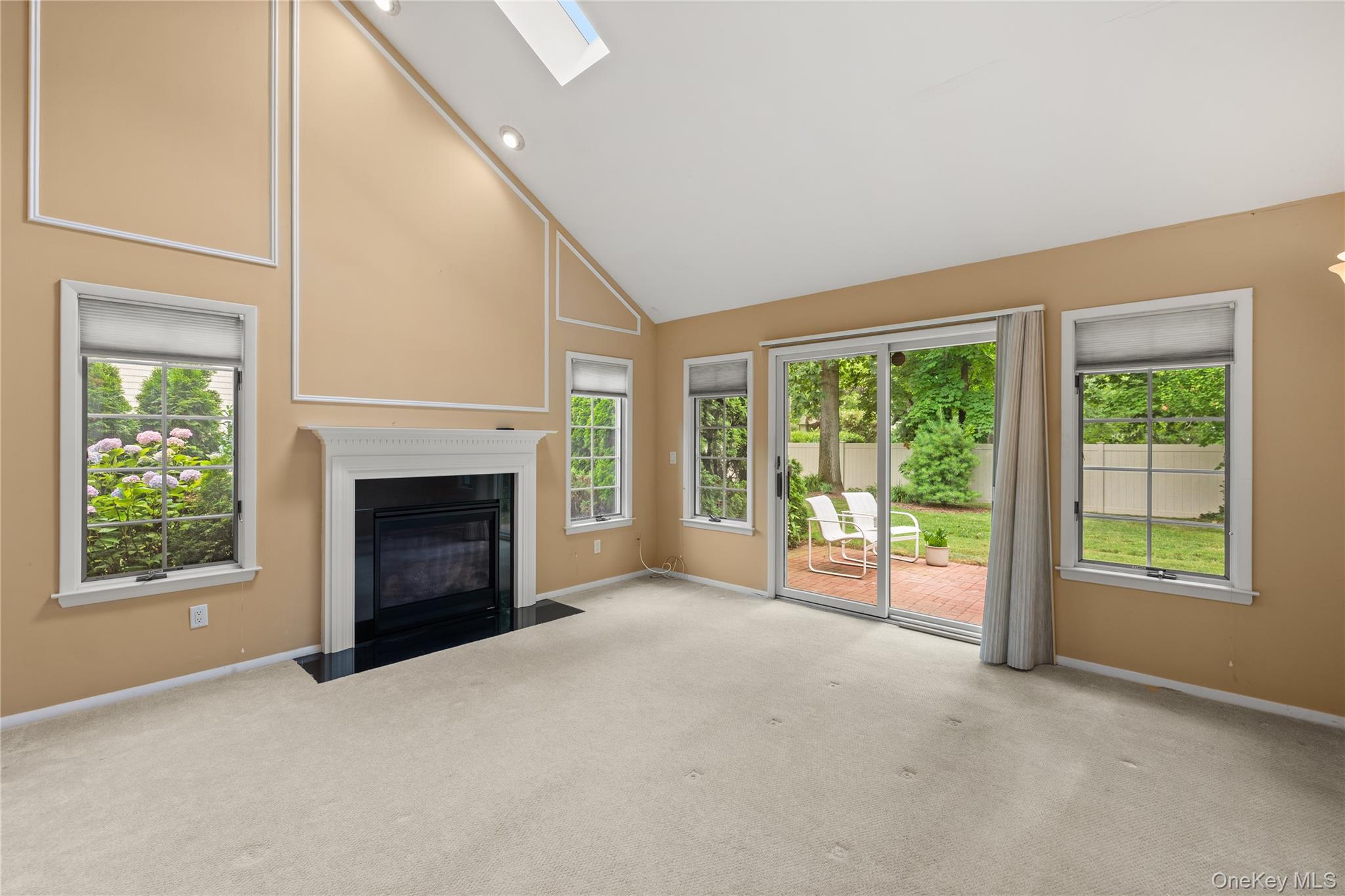 34 Cedar Ridge Lane Bay Shore, NY 11706 - Photo 7 of 27 a view of an empty room with window and fire place