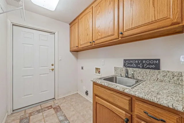 a bathroom with a sink vanity granite and a mirror