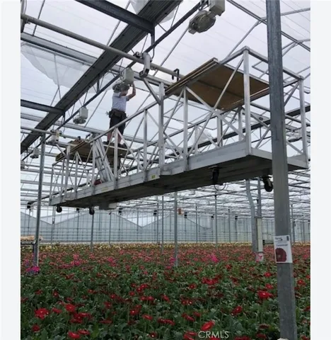an aerial view of residential house with outdoor space and mountain view