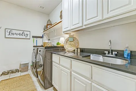 a kitchen with stainless steel appliances granite countertop a sink and cabinets